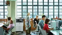 People working and collaborating in a modern office