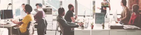 Group-of-people-working-at-office-by-printer-copier