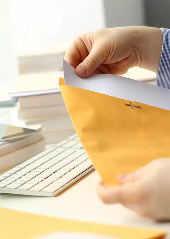 Man opening a letter - Hybrid mail